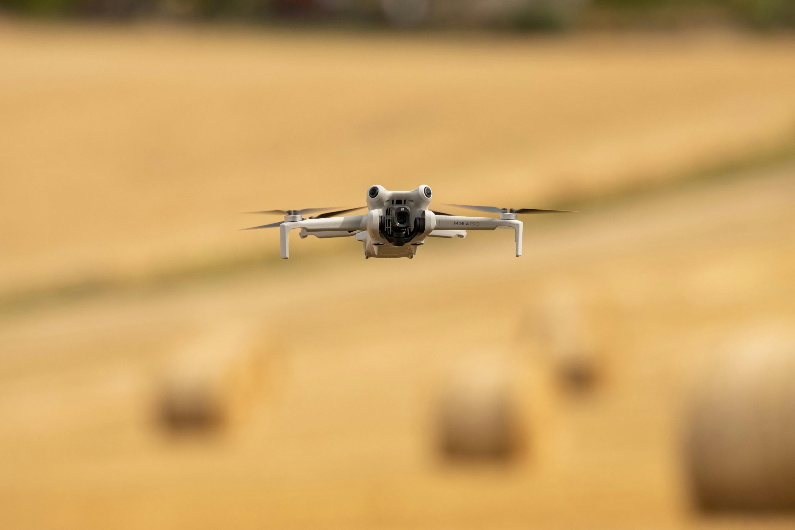 Aerial shot of a drone flying over a wheat field in Gränna, Sweden during a sunny day.
